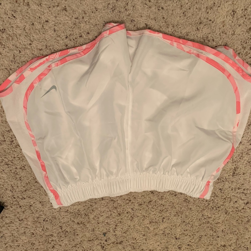 Pink and white Nike shorts
